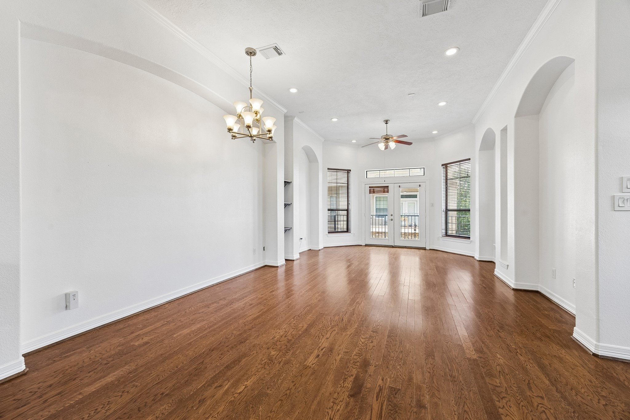4102 Bonner View Lane Houston, TX 77007 - Photo 4 of 14 a view of an empty room with wooden floor and windows
