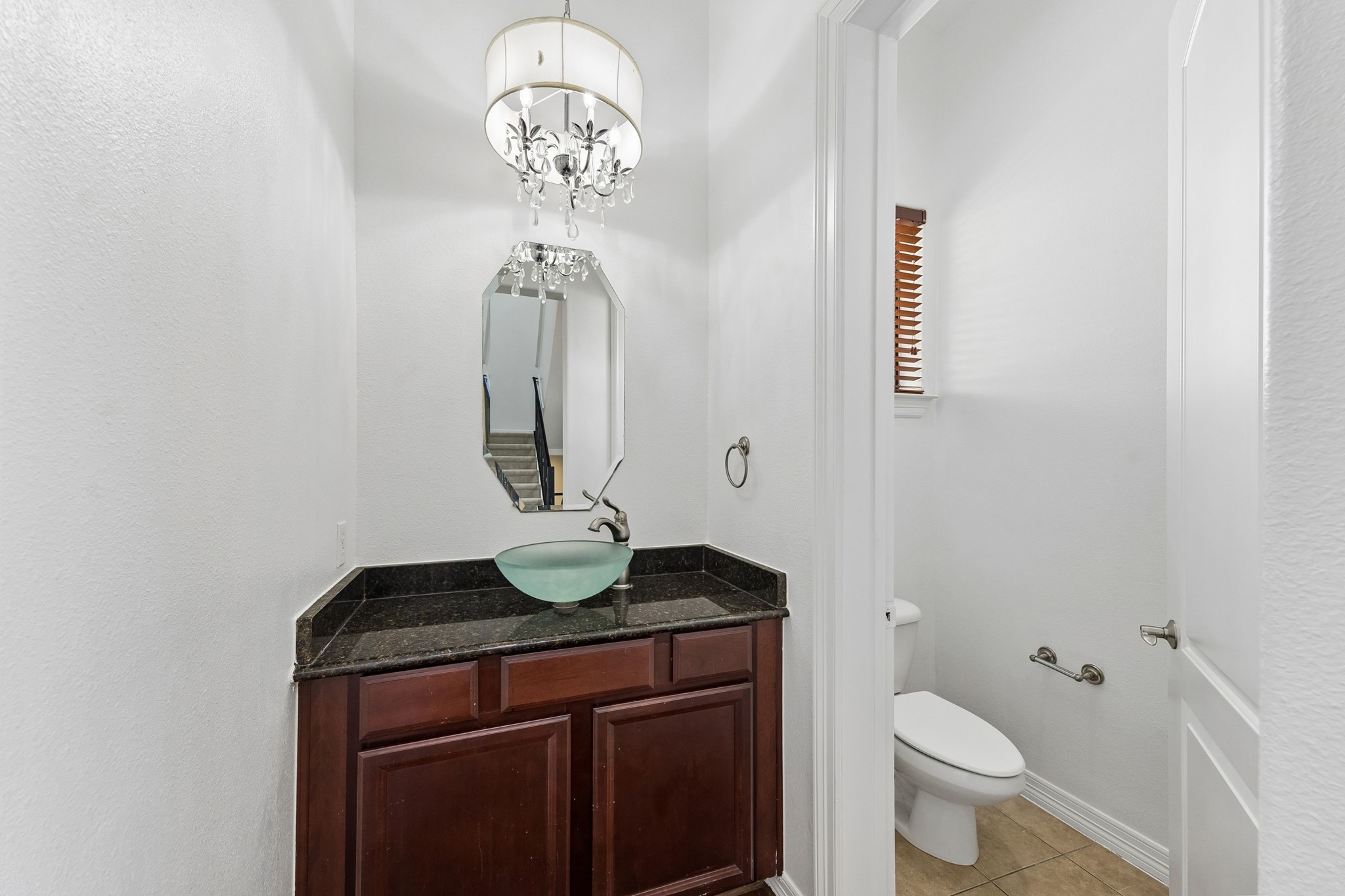 4102 Bonner View Lane Houston, TX 77007 - Photo 5 of 14 a bathroom with a granite countertop sink a toilet and a mirror