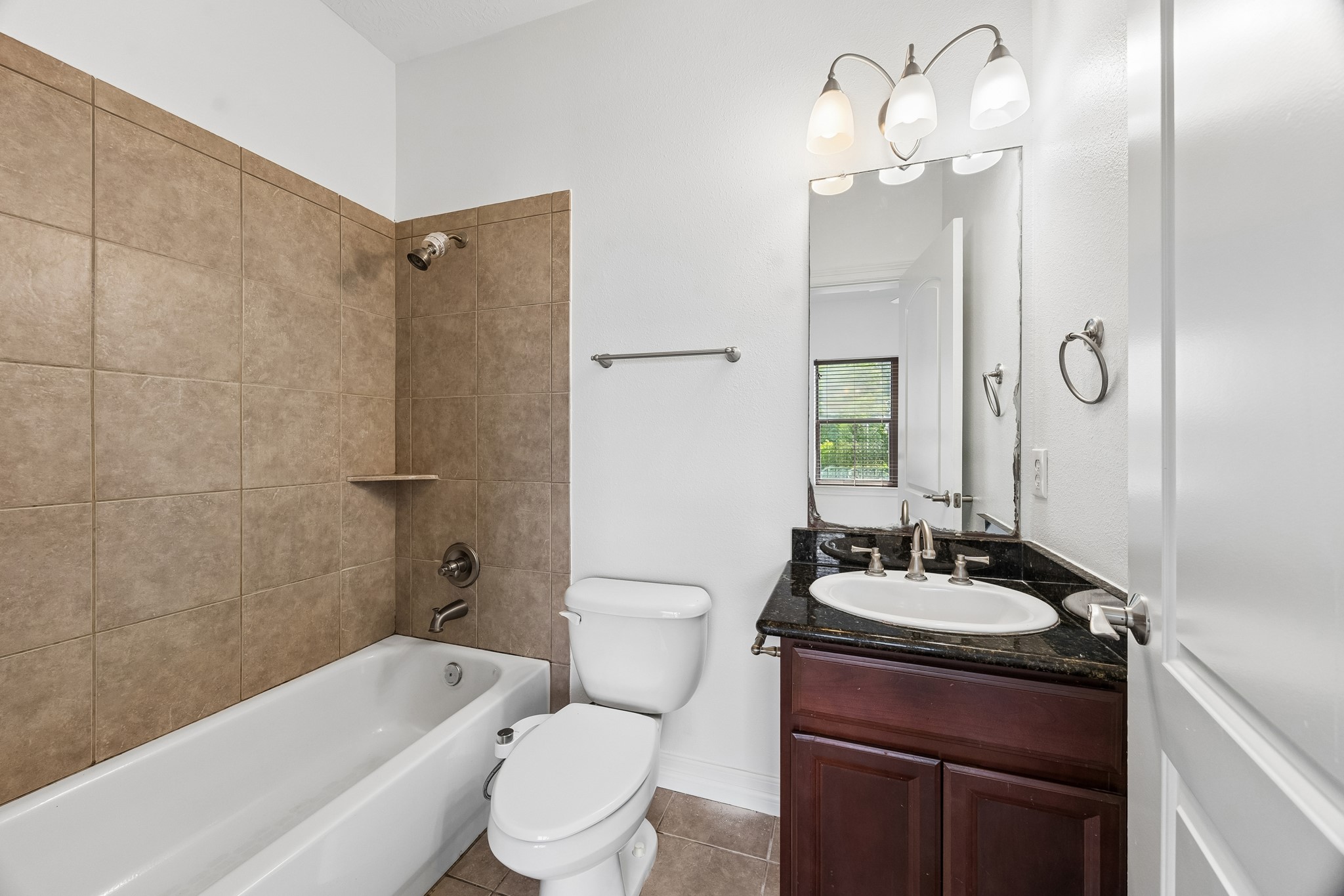 4102 Bonner View Lane Houston, TX 77007 - Photo 10 of 14 a bathroom with a double vanity sink toilet mirror and shower