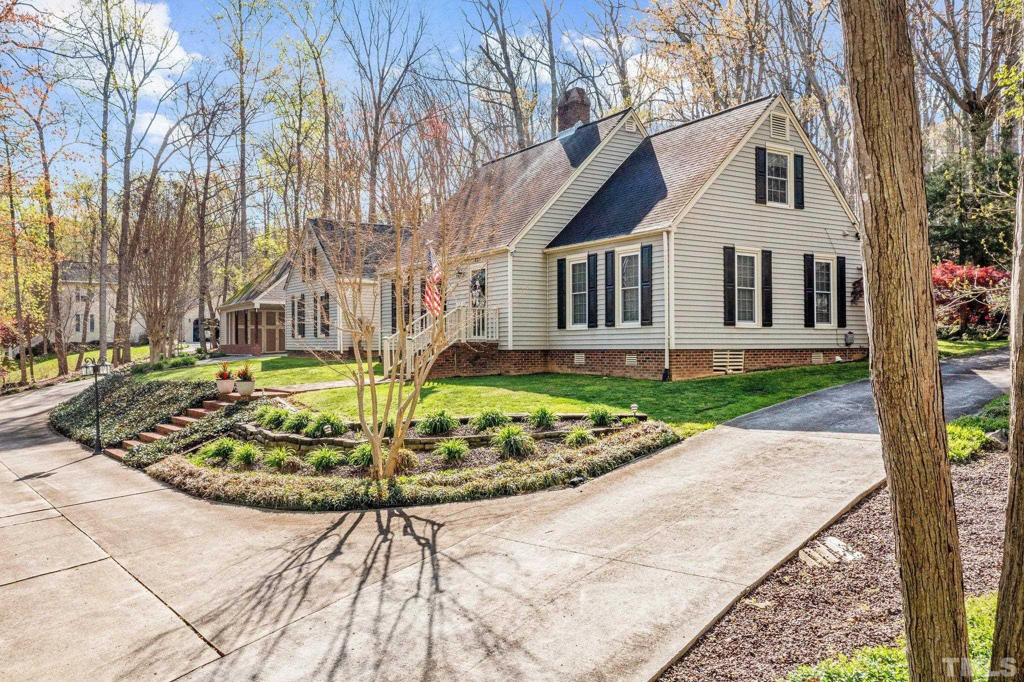225 North Ridge Circle Roxboro, NC 27574 - Photo 1 of 33 a front view of a house with garden