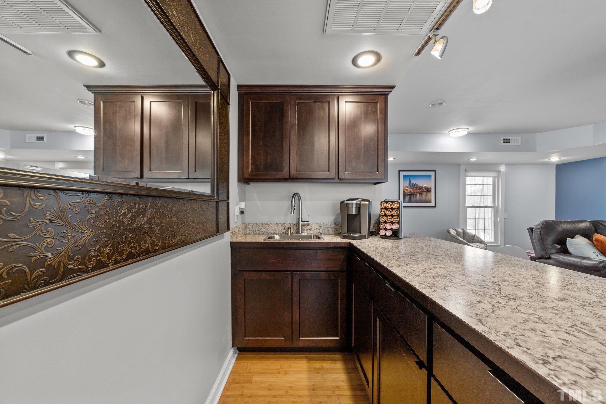 225 North Ridge Circle Roxboro, NC 27574 - Photo 11 of 33 a kitchen with granite countertop a sink and cabinets