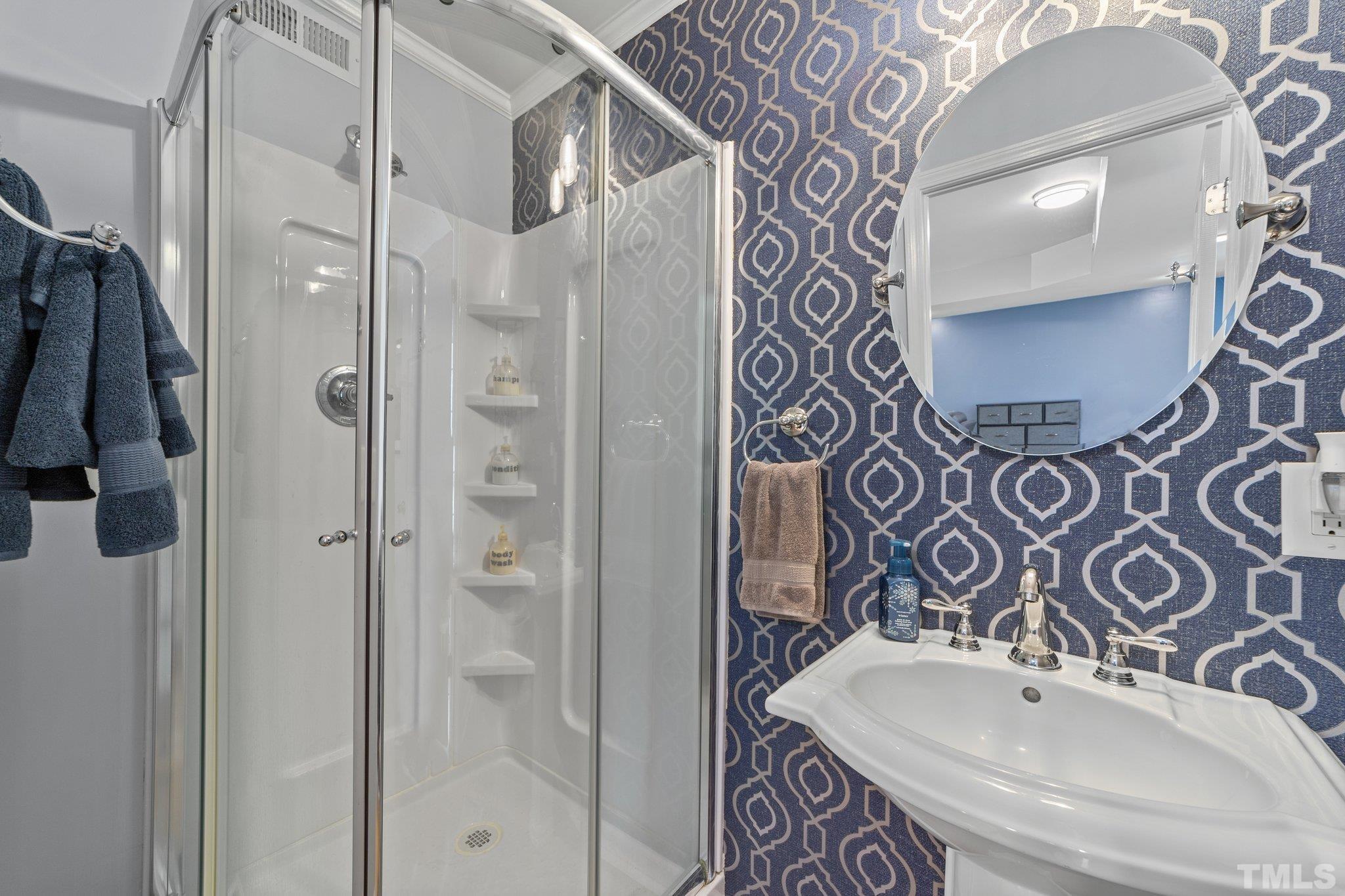 225 North Ridge Circle Roxboro, NC 27574 - Photo 13 of 33 a bathroom with a sink and mirror