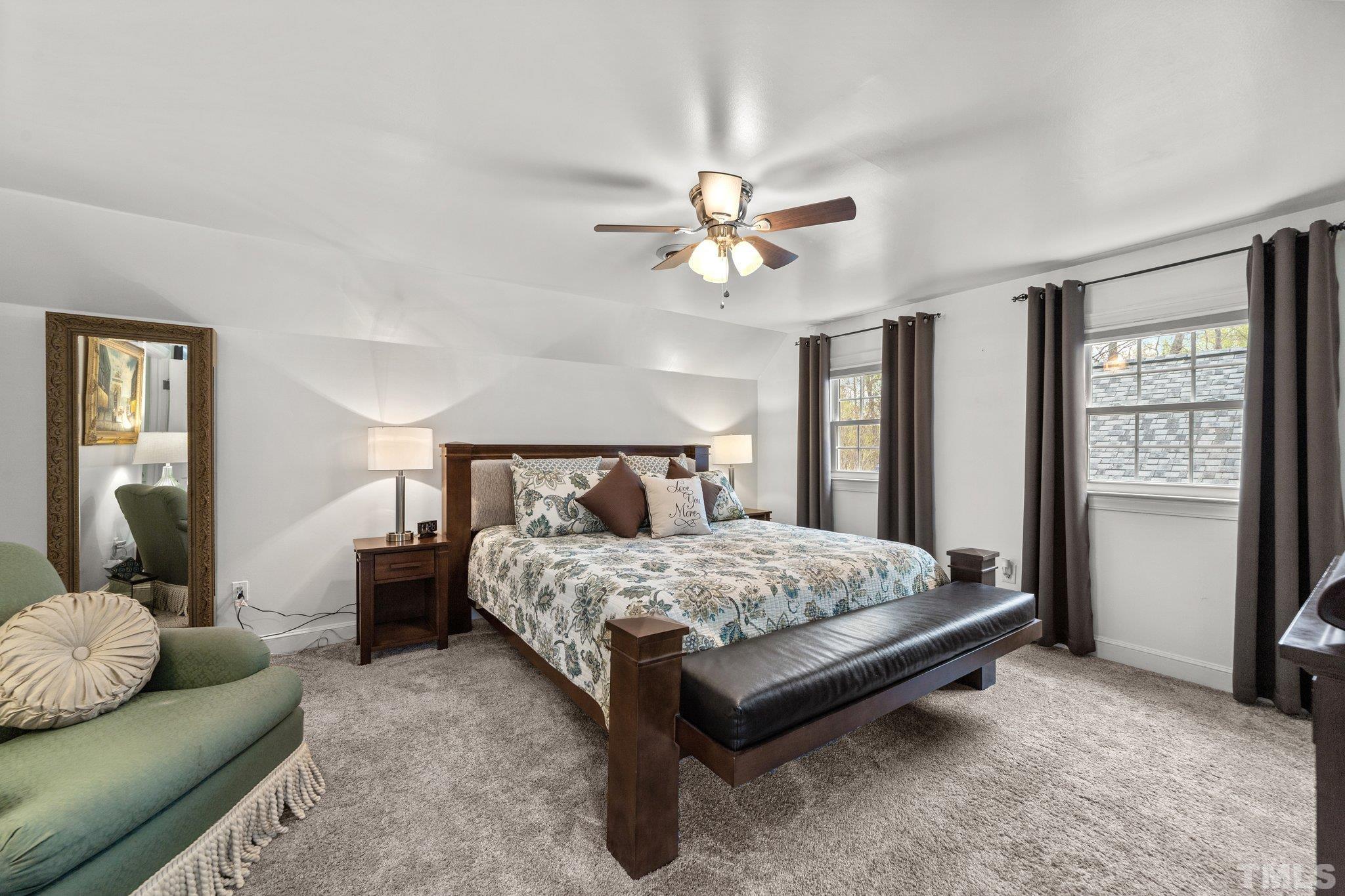 225 North Ridge Circle Roxboro, NC 27574 - Photo 20 of 33 a bedroom with a bed couch and window