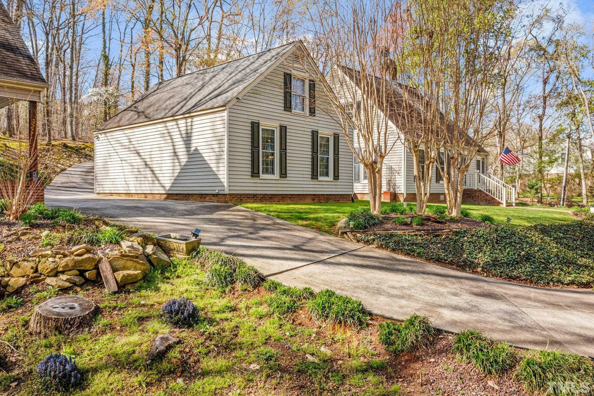 225 North Ridge Circle Roxboro, NC 27574 - Photo 2 of 33 a front view of a house with a yard and garage