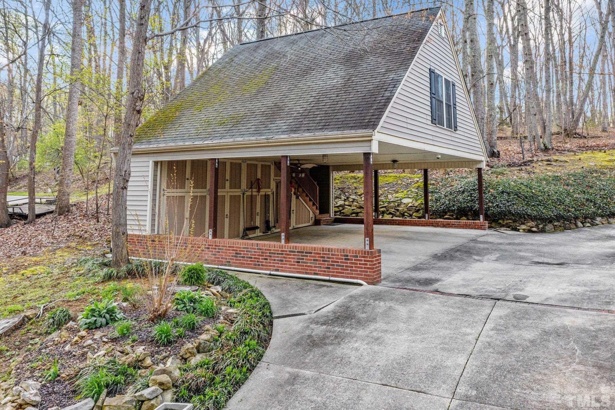 225 North Ridge Circle Roxboro, NC 27574 - Photo 27 of 33 a view of a house with backyard and porch