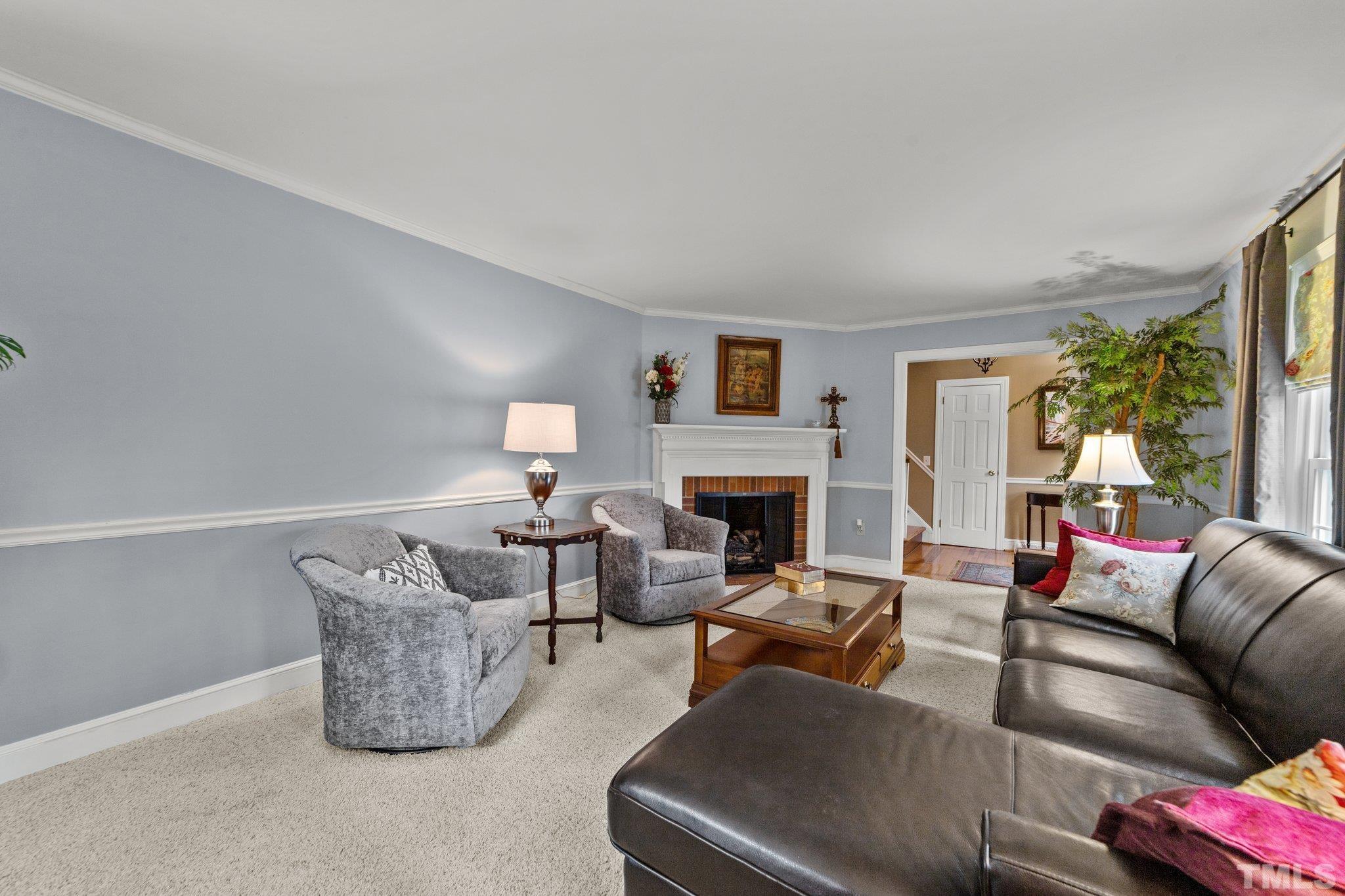 225 North Ridge Circle Roxboro, NC 27574 - Photo 6 of 33 a living room with furniture and a fireplace