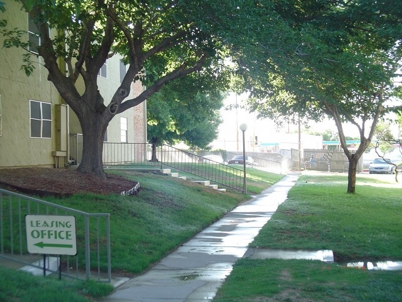 1222 Giles Road, Unit 156 El Paso, TX 79915 - Photo 1 of 6 a view of a park with large trees