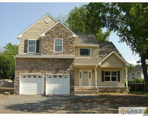 408 Old Georges Road North Brunswick, NJ 08902 - Photo 1 of 7 a front view of a house with a yard