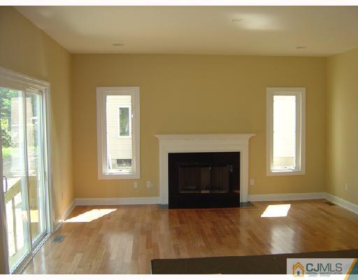408 Old Georges Road North Brunswick, NJ 08902 - Photo 4 of 7 a view of a livingroom with a fireplace and window