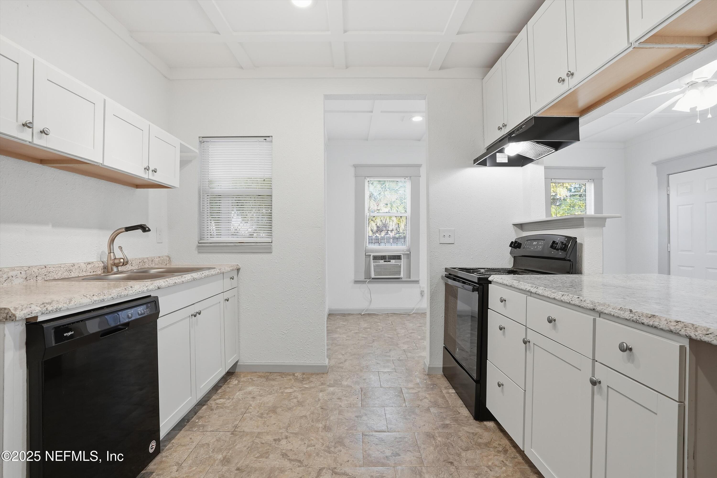 911 Phillips Street Jacksonville, FL 32207 - Photo 11 of 36 a kitchen with a sink and cabinets