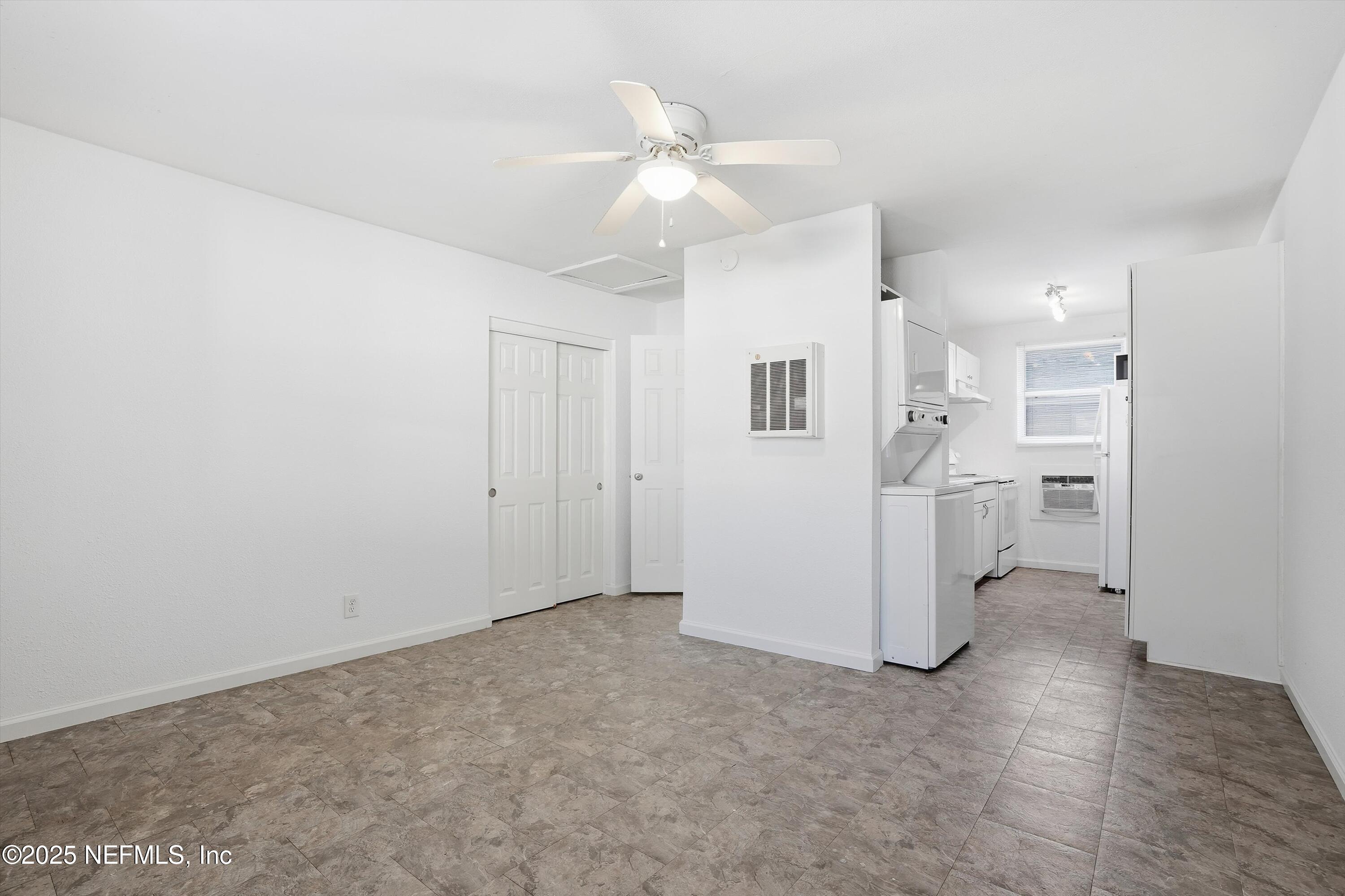 911 Phillips Street Jacksonville, FL 32207 - Photo 20 of 36 a view of a kitchen with a sink and a refrigerator