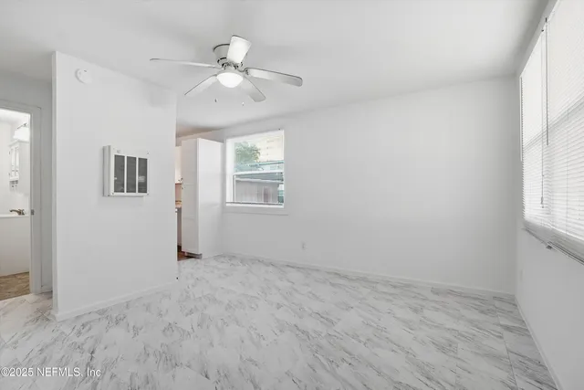 a view of an empty room with a window