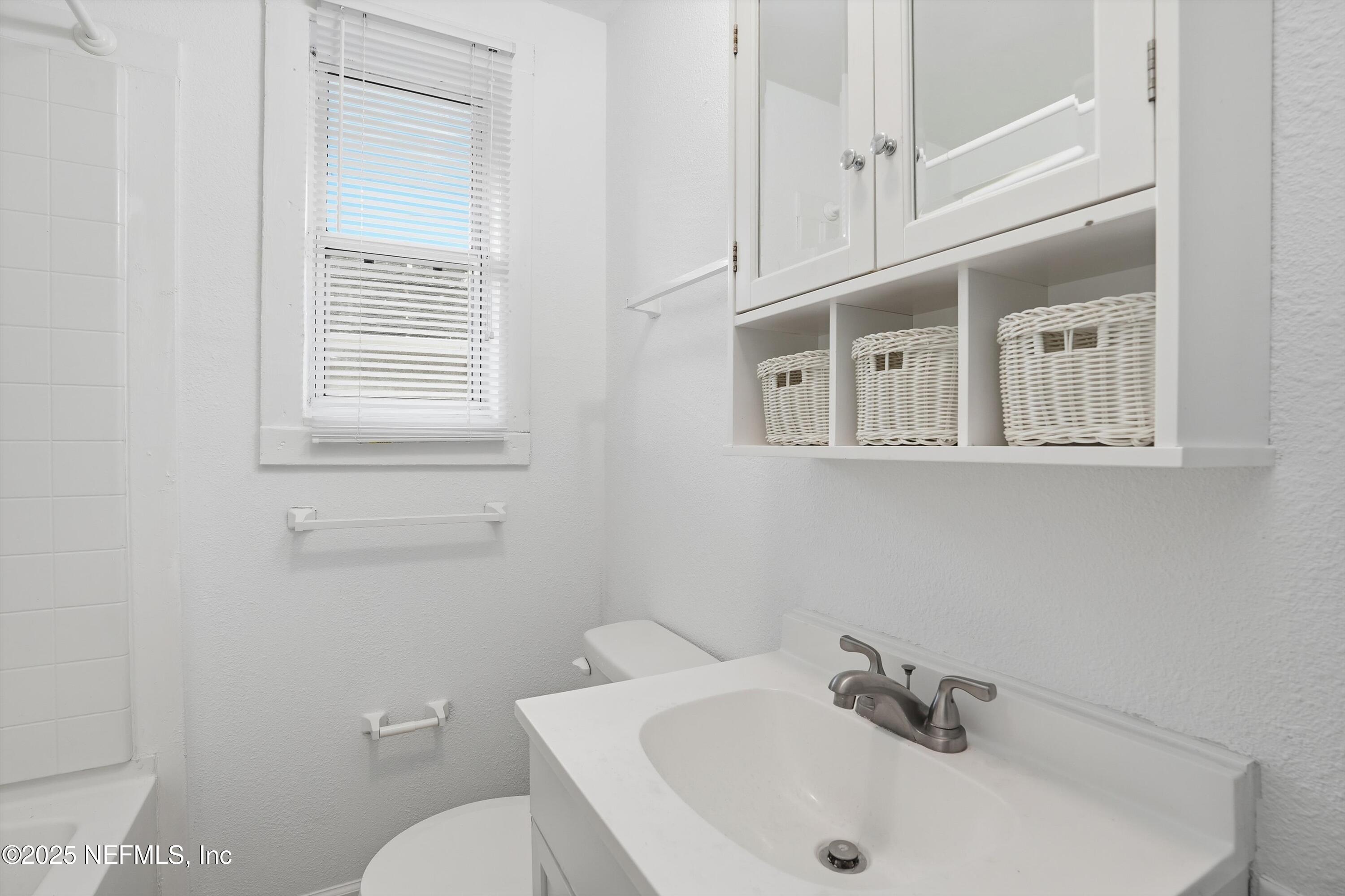 911 Phillips Street Jacksonville, FL 32207 - Photo 30 of 36 a bathroom with a sink and a toilet
