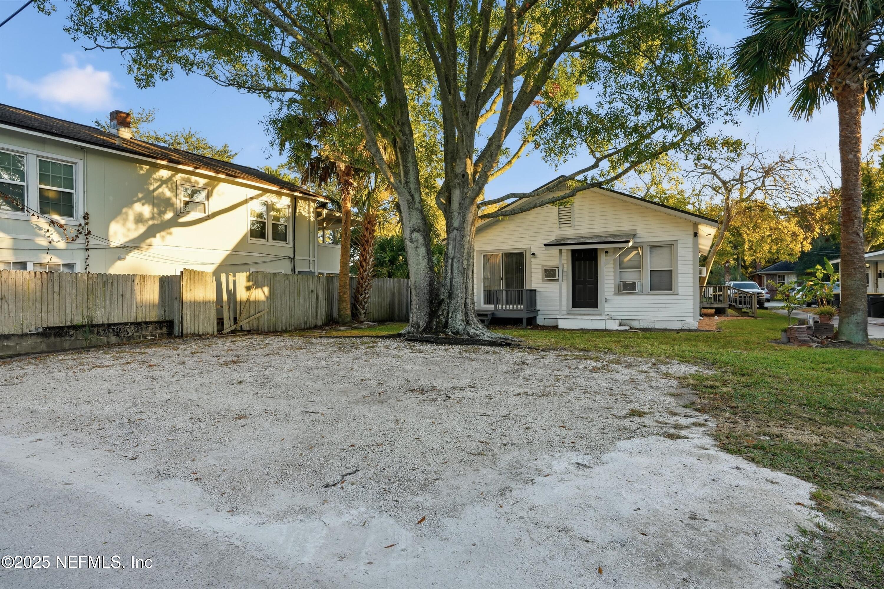 911 Phillips Street Jacksonville, FL 32207 - Photo 31 of 36 a front view of a house with a yard and trees