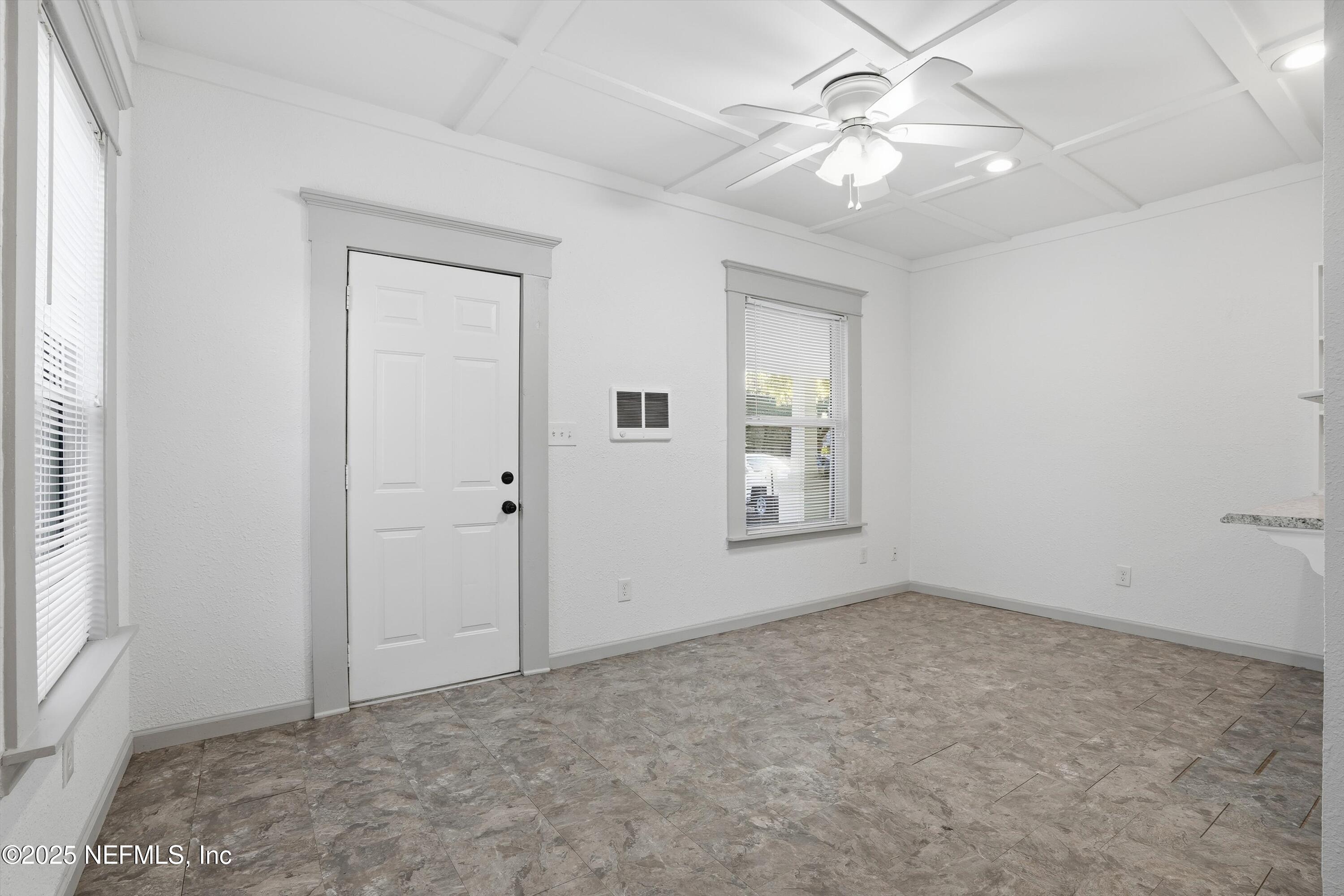 911 Phillips Street Jacksonville, FL 32207 - Photo 9 of 36 an empty room with fan and windows