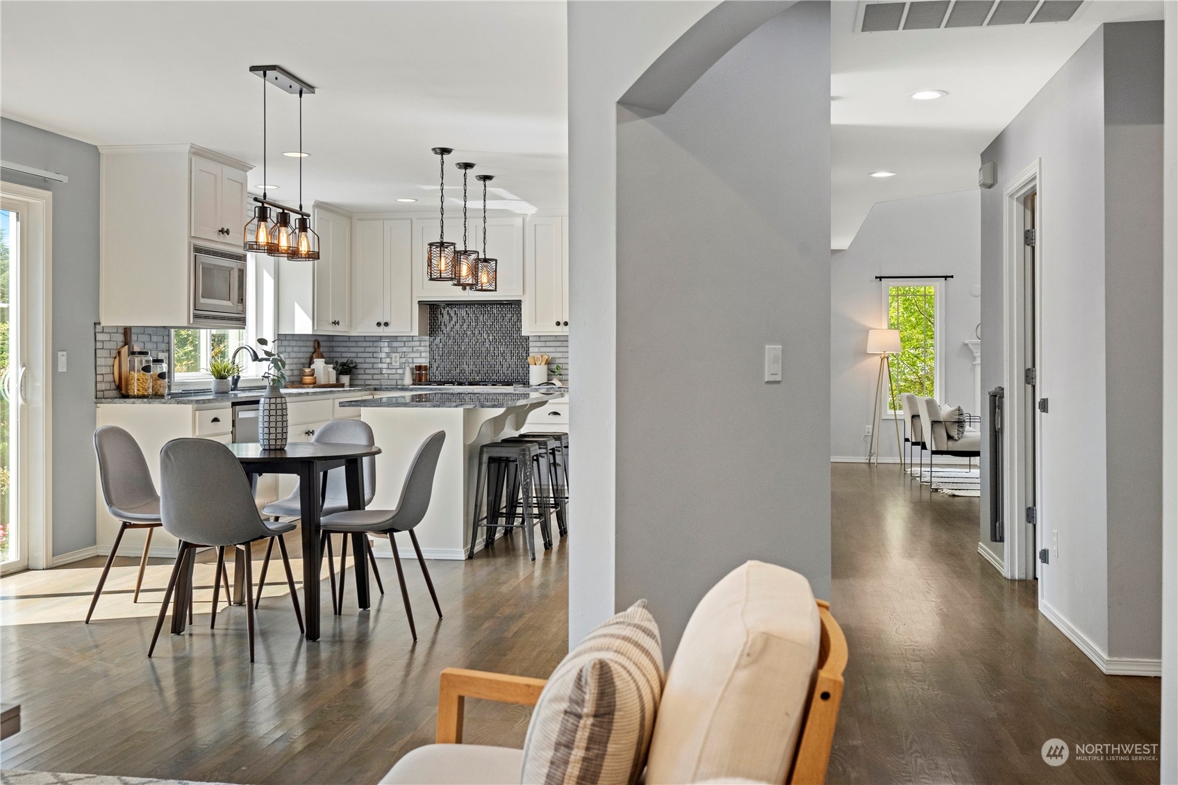 4410 239th Place Southeast Bothell, WA 98021 - Photo 17 of 40 a view of a dining room with furniture and wooden floor