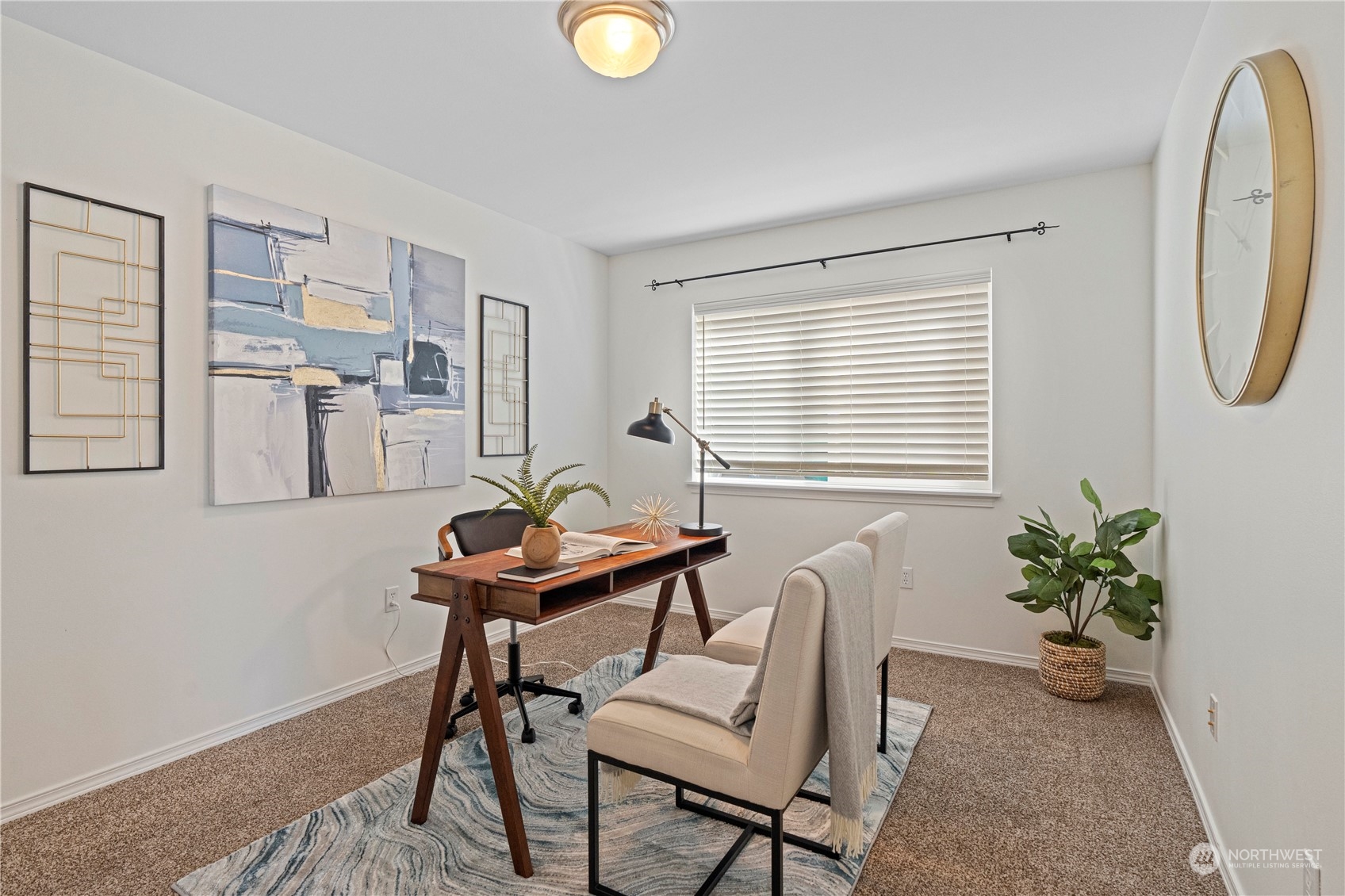 4410 239th Place Southeast Bothell, WA 98021 - Photo 18 of 40 a work room with furniture and a potted plant