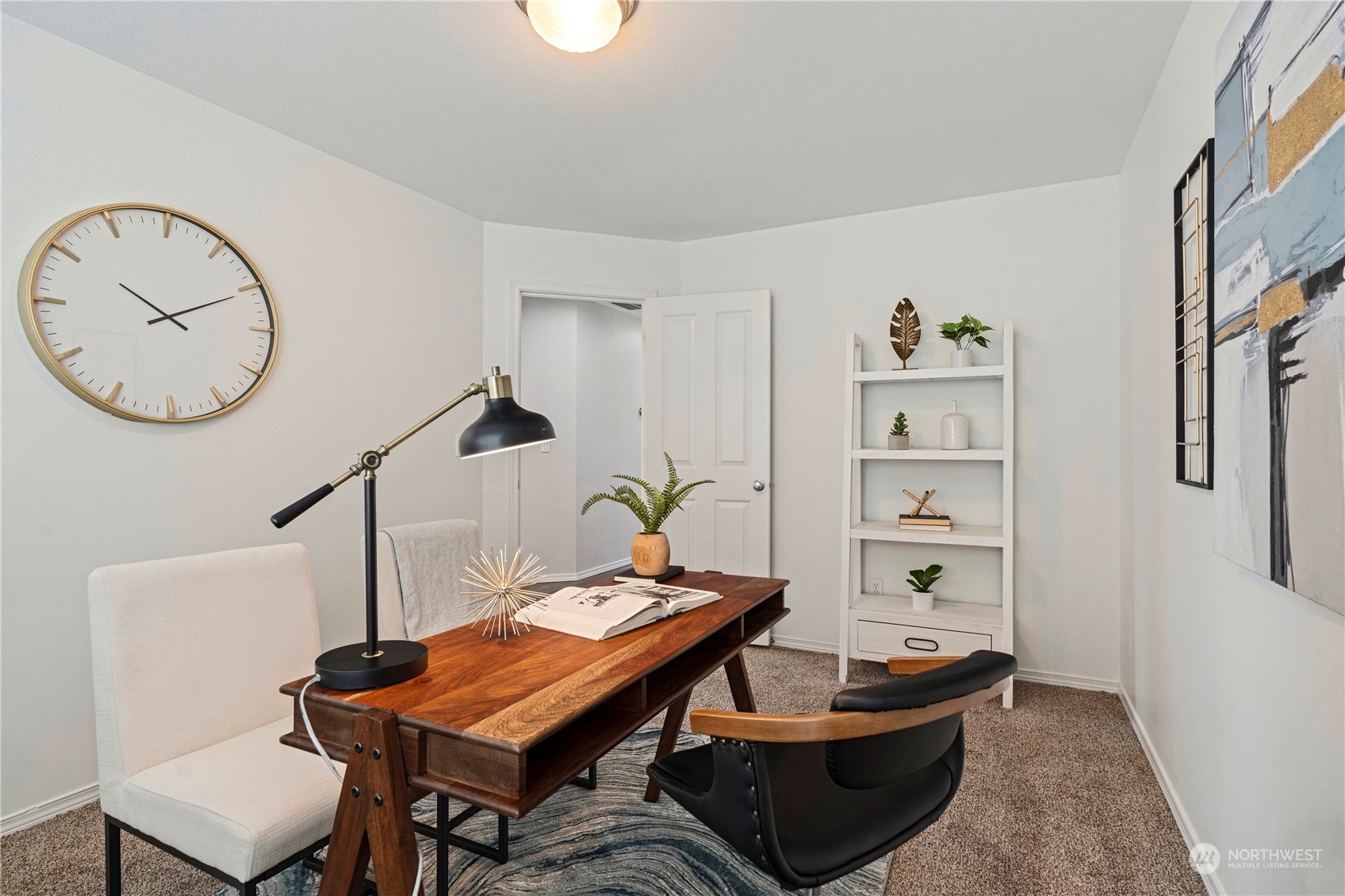 4410 239th Place Southeast Bothell, WA 98021 - Photo 19 of 40 a living room with furniture a clock and a window