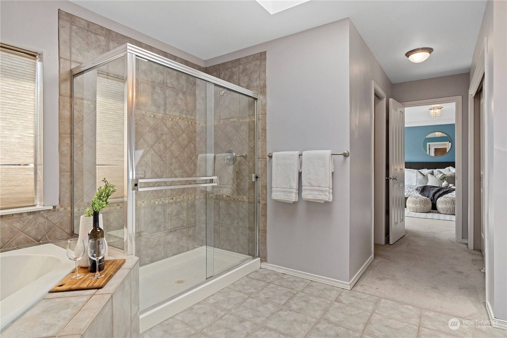 4410 239th Place Southeast Bothell, WA 98021 - Photo 26 of 40 a bathroom with a tub shower and sink