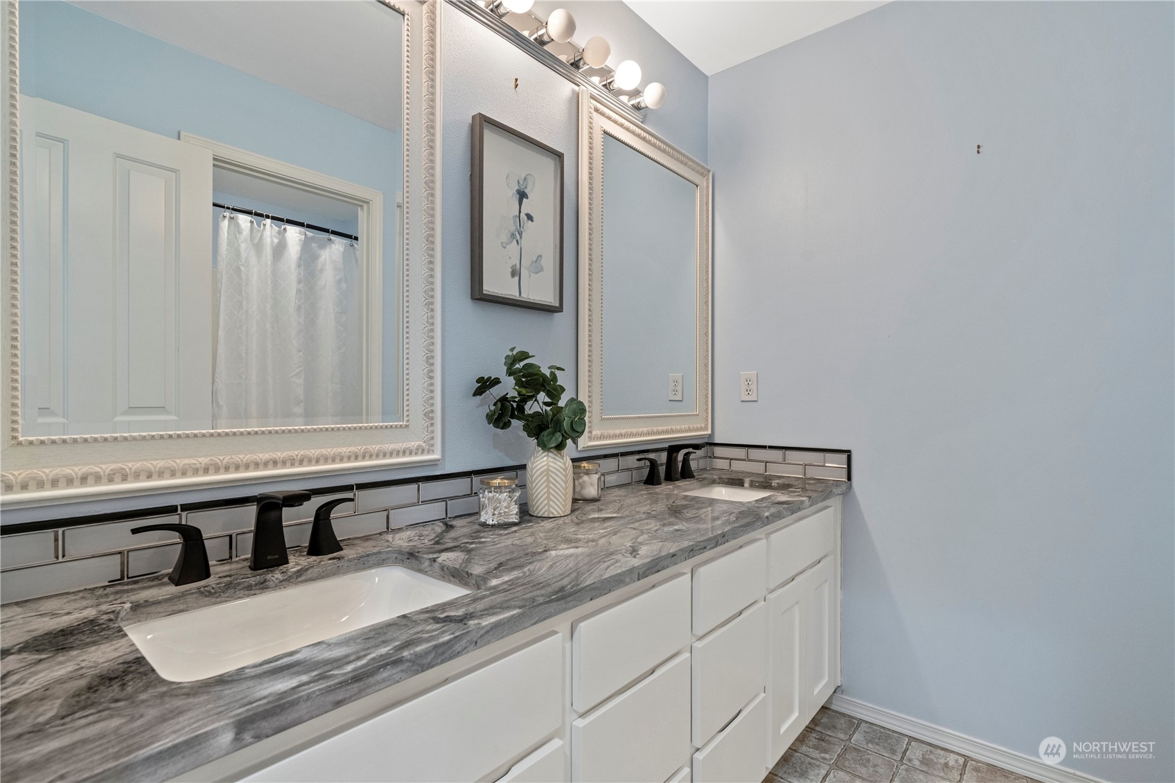 4410 239th Place Southeast Bothell, WA 98021 - Photo 31 of 40 a bathroom with a granite countertop sink and a mirror