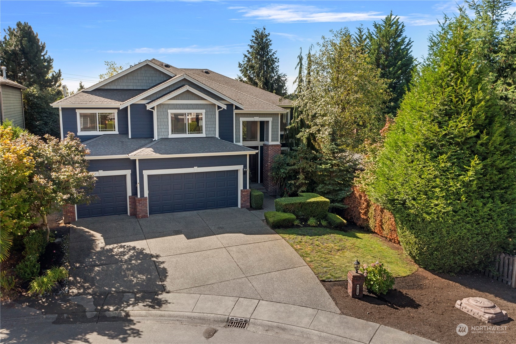 4410 239th Place Southeast Bothell, WA 98021 - Photo 38 of 40 a front view of a house with a yard and garage