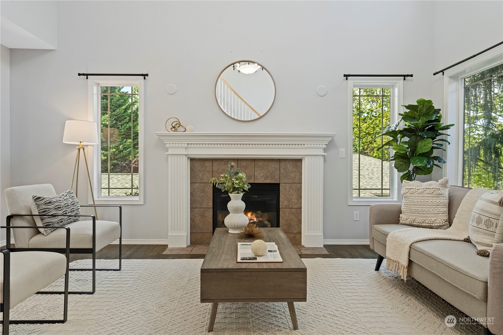 4410 239th Place Southeast Bothell, WA 98021 - Photo 4 of 40 a living room with furniture a window and a fireplace