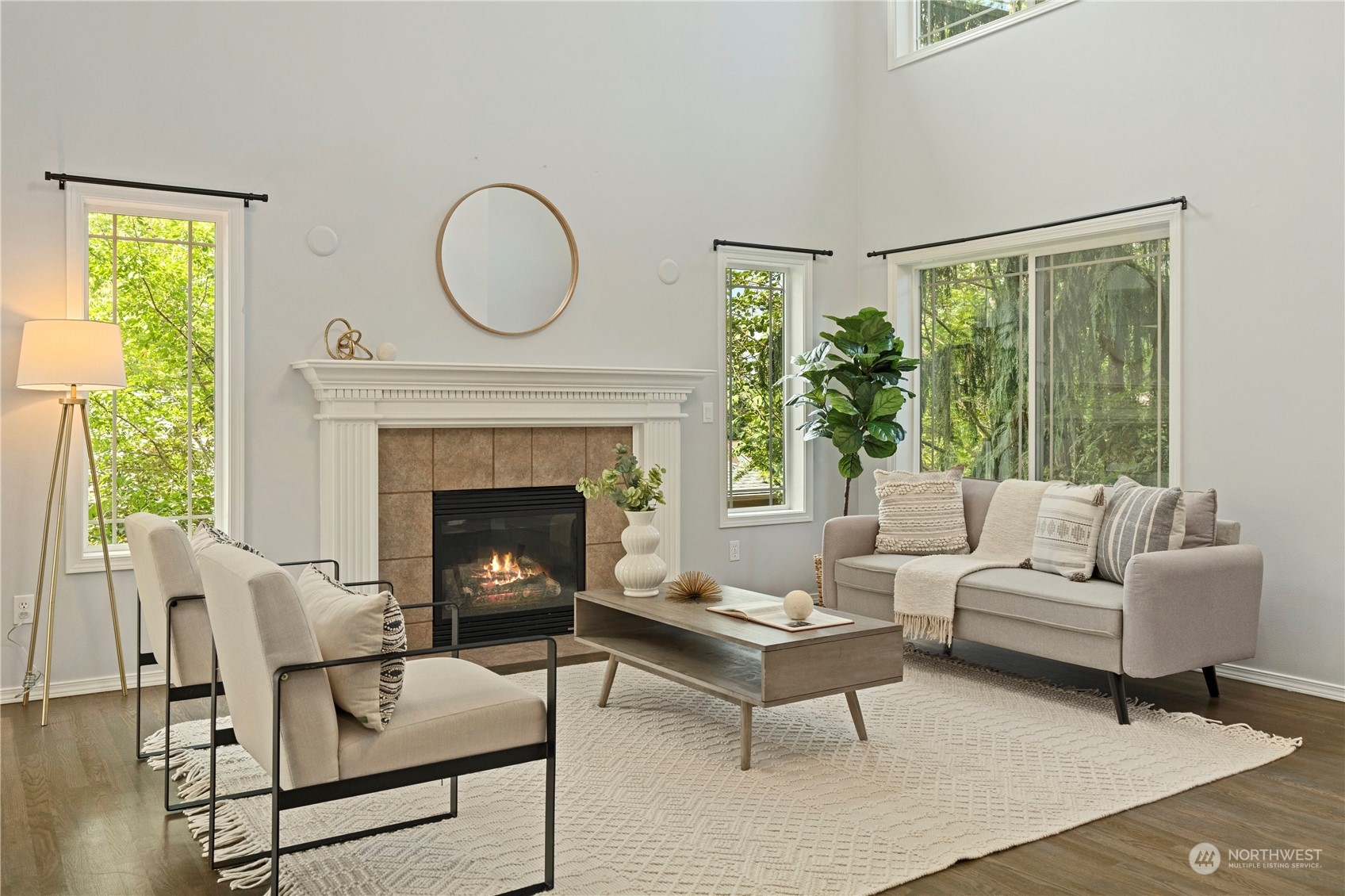 4410 239th Place Southeast Bothell, WA 98021 - Photo 5 of 40 a living room with furniture a large window and a fireplace