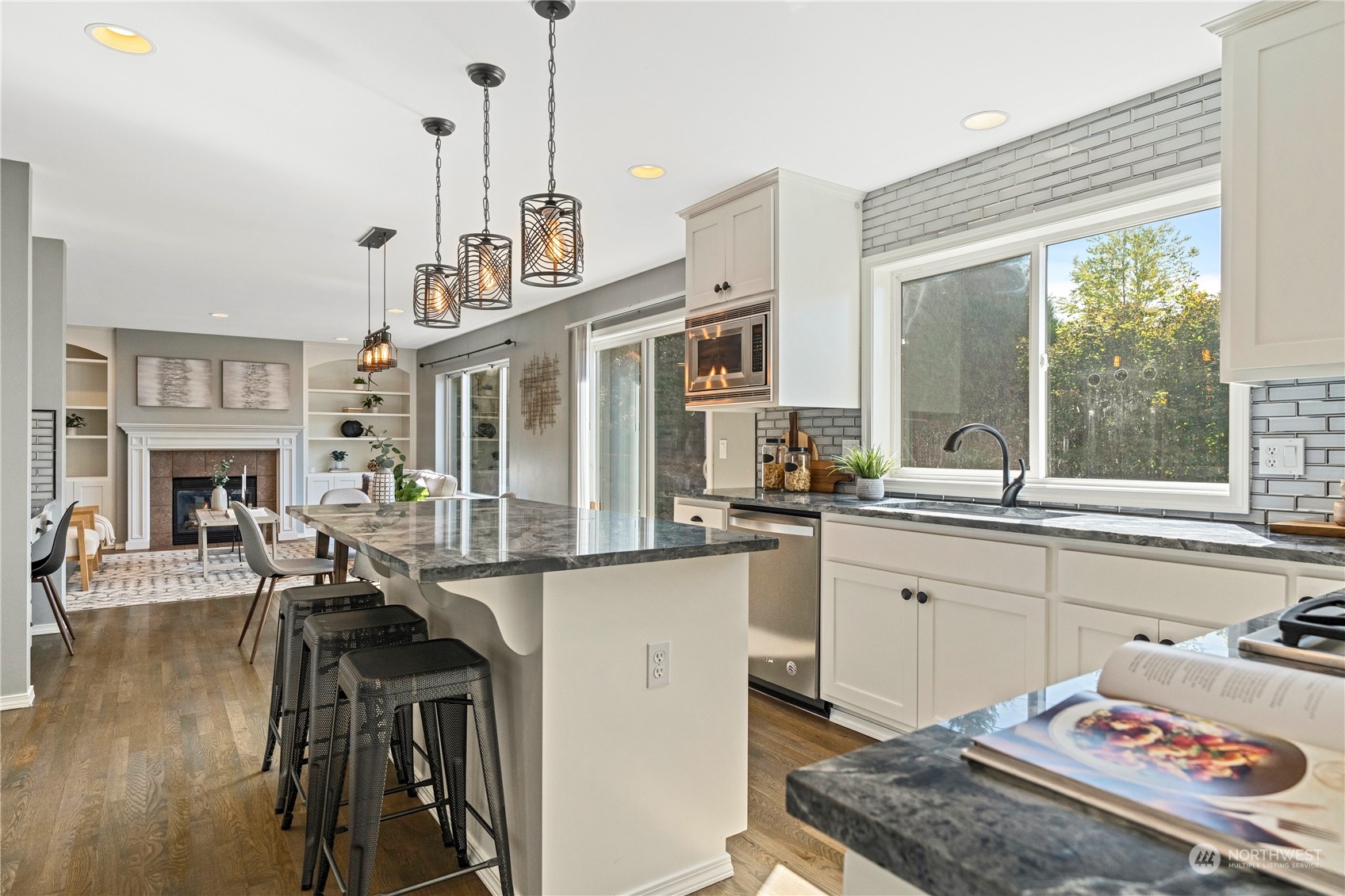 4410 239th Place Southeast Bothell, WA 98021 - Photo 8 of 40 a very nice looking dining room with a large window and a wooden floor