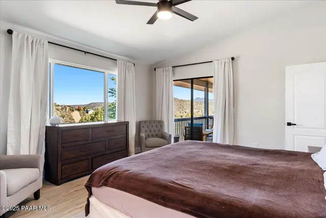 a bathroom with a granite countertop toilet a sink and a mirror