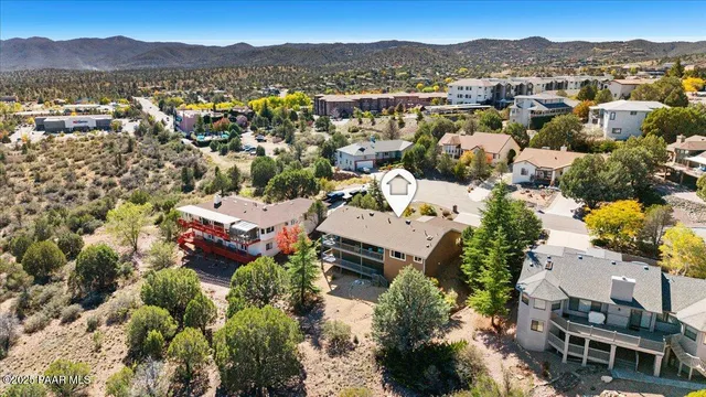 a front view of a house with a garden and plants