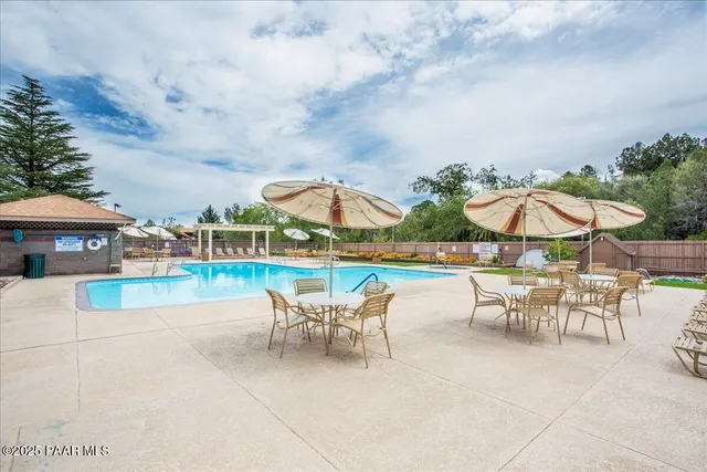 a view of yard with grass & trees