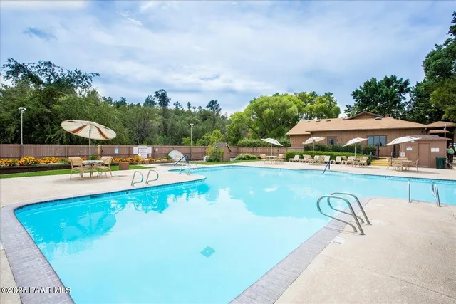a view of a park with large trees