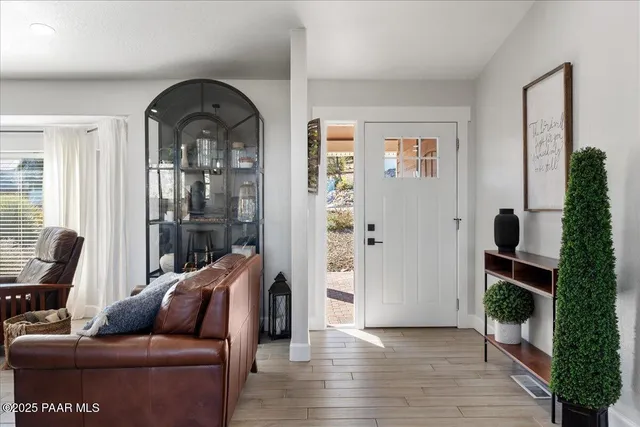 a living room with furniture and a gate