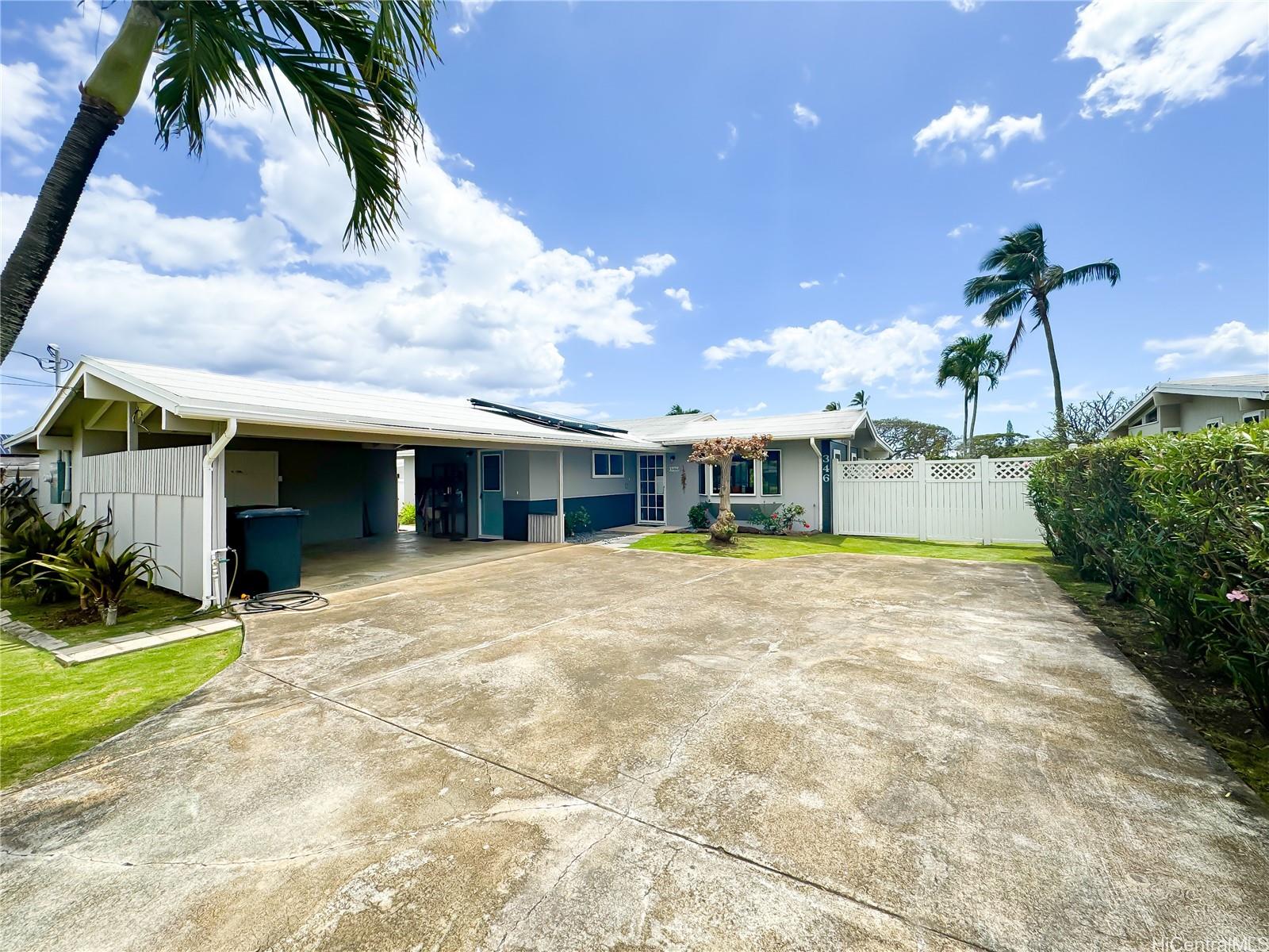 346 Ilimalia Loop Kailua, HI 96734 - Photo 16 of 24 a front view of a house with a yard and garage