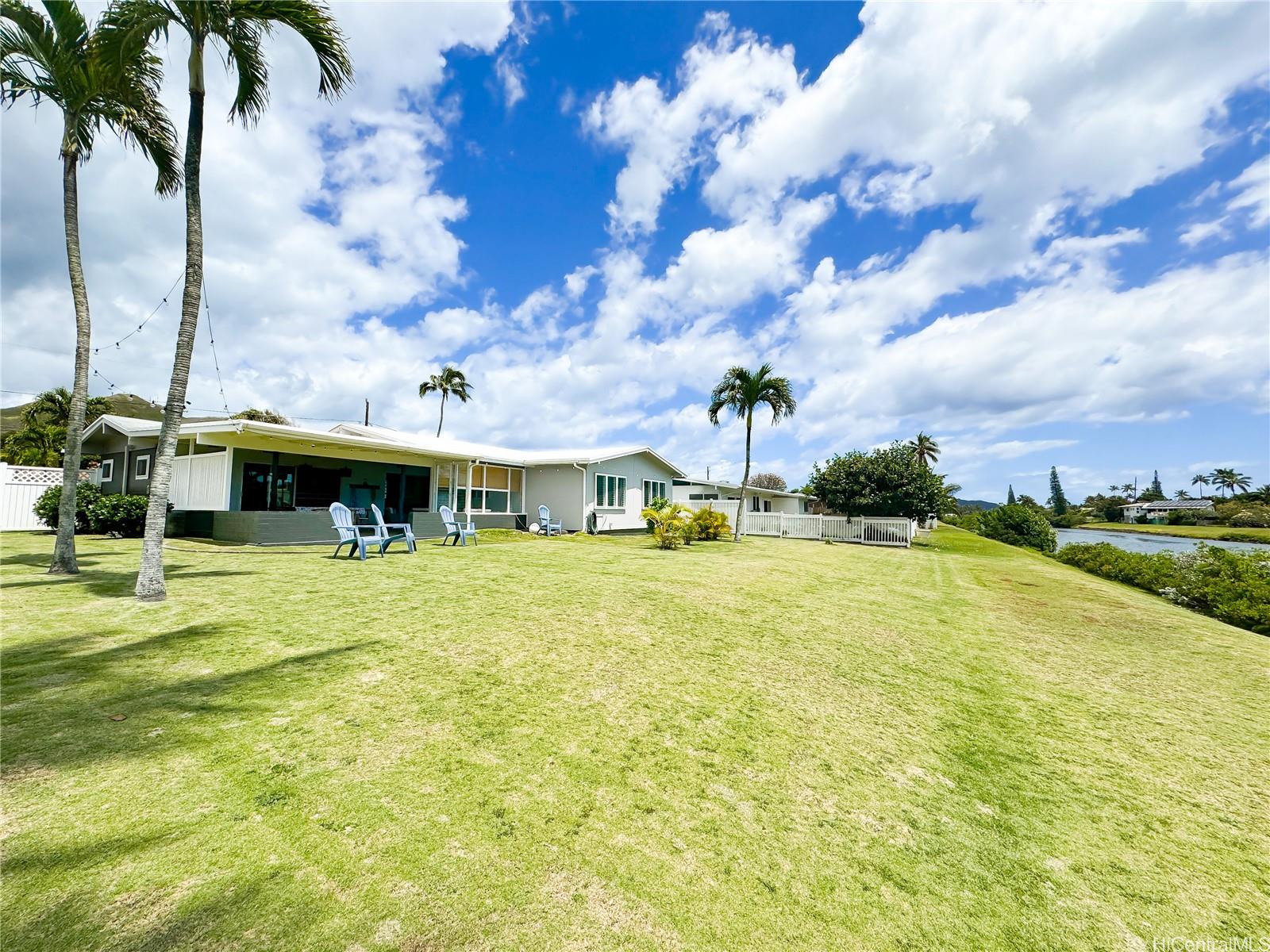 346 Ilimalia Loop Kailua, HI 96734 - Photo 17 of 24 a front view of a house with swimming pool and green space
