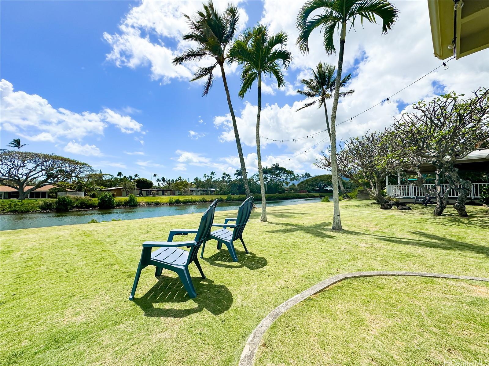 346 Ilimalia Loop Kailua, HI 96734 - Photo 21 of 24 a view of a swimming pool with a table and chairs
