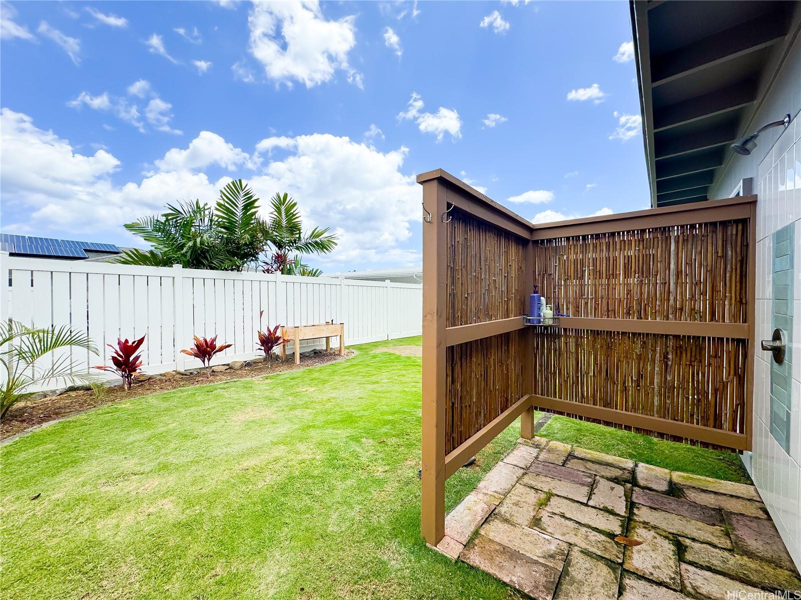 346 Ilimalia Loop Kailua, HI 96734 - Photo 23 of 24 a view of a backyard with a small cabin and a chair