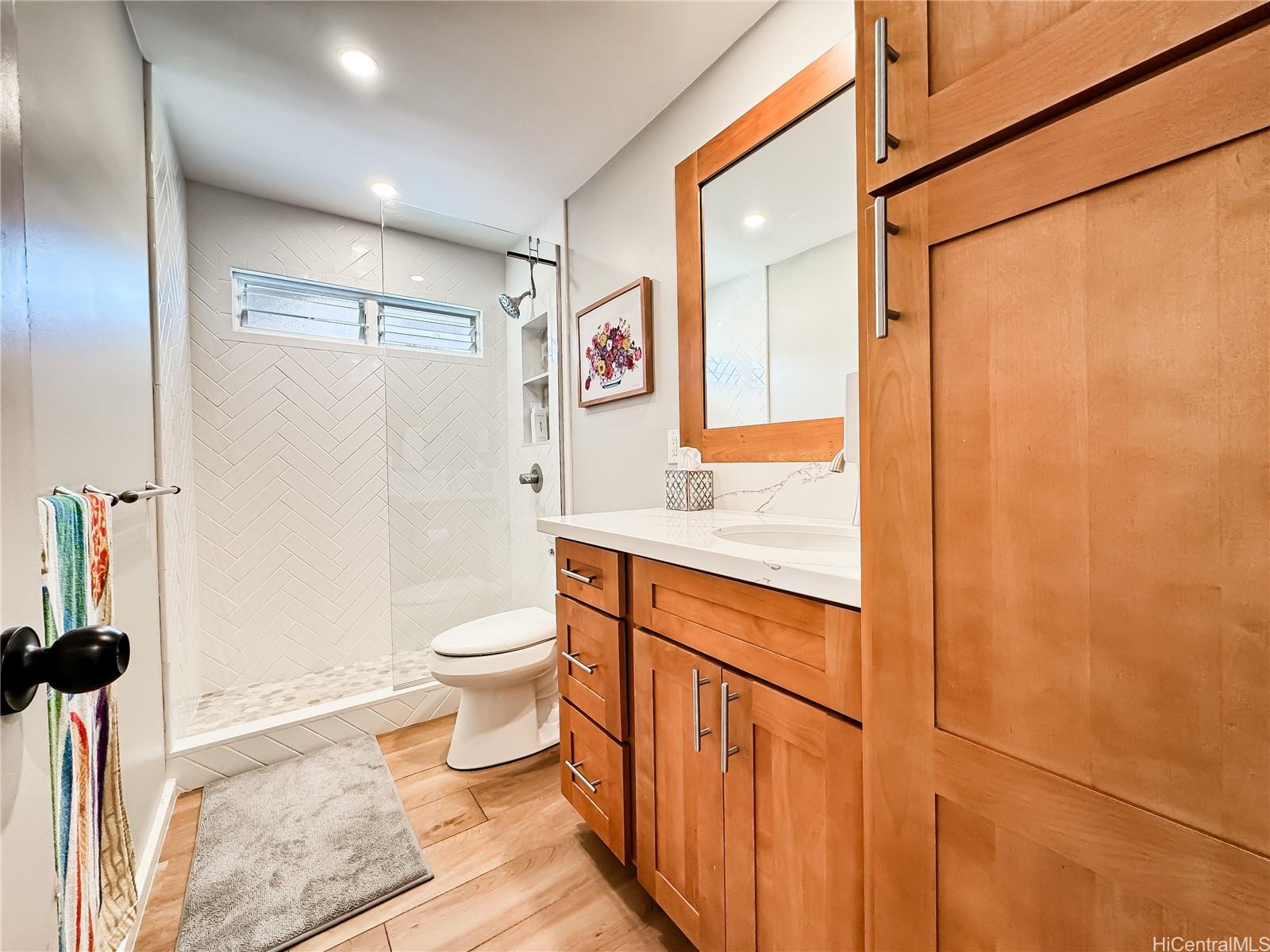 346 Ilimalia Loop Kailua, HI 96734 - Photo 10 of 24 a bathroom with a granite countertop sink toilet and shower