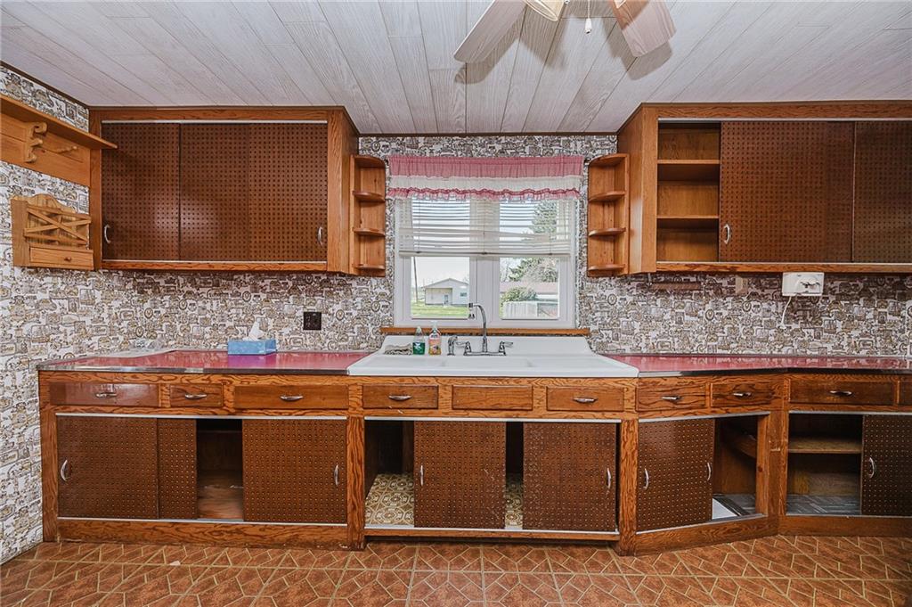 151 Hemlock Road Commodore, PA 15729 - Photo 14 of 50 a kitchen with stainless steel appliances granite countertop a stove and a microwave
