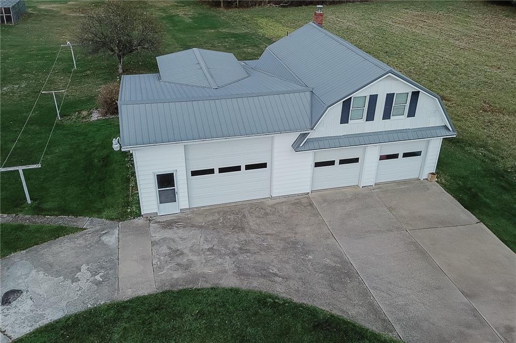 151 Hemlock Road Commodore, PA 15729 - Photo 33 of 50 a front view of a house with a yard and garage