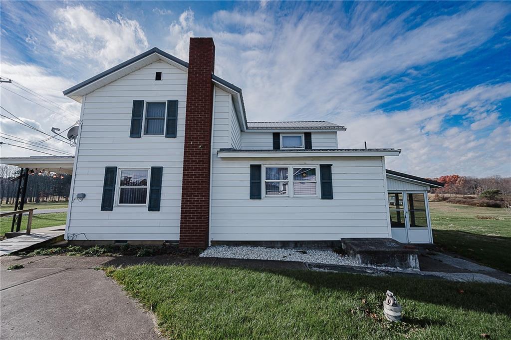 151 Hemlock Road Commodore, PA 15729 - Photo 4 of 50 a front view of a house with a yard