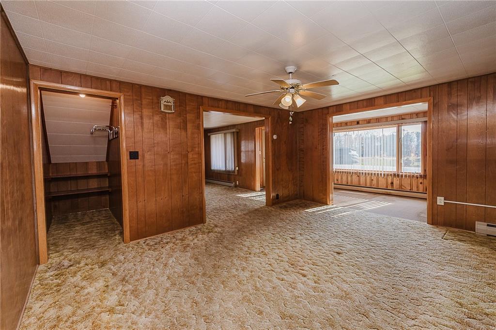 151 Hemlock Road Commodore, PA 15729 - Photo 10 of 50 en empty room with windows and fan