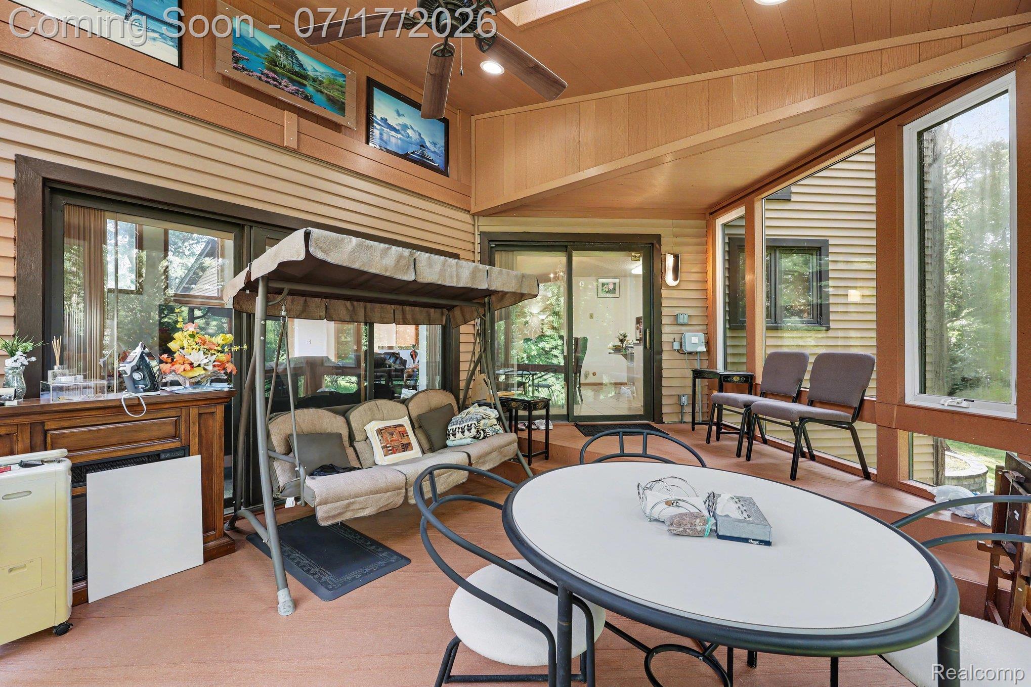 5685 Paint Valley Drive Rochester, MI 48306 - Photo 25 of 66 Screened porch featuring wood-finish wall paneling and a coordinated ceiling