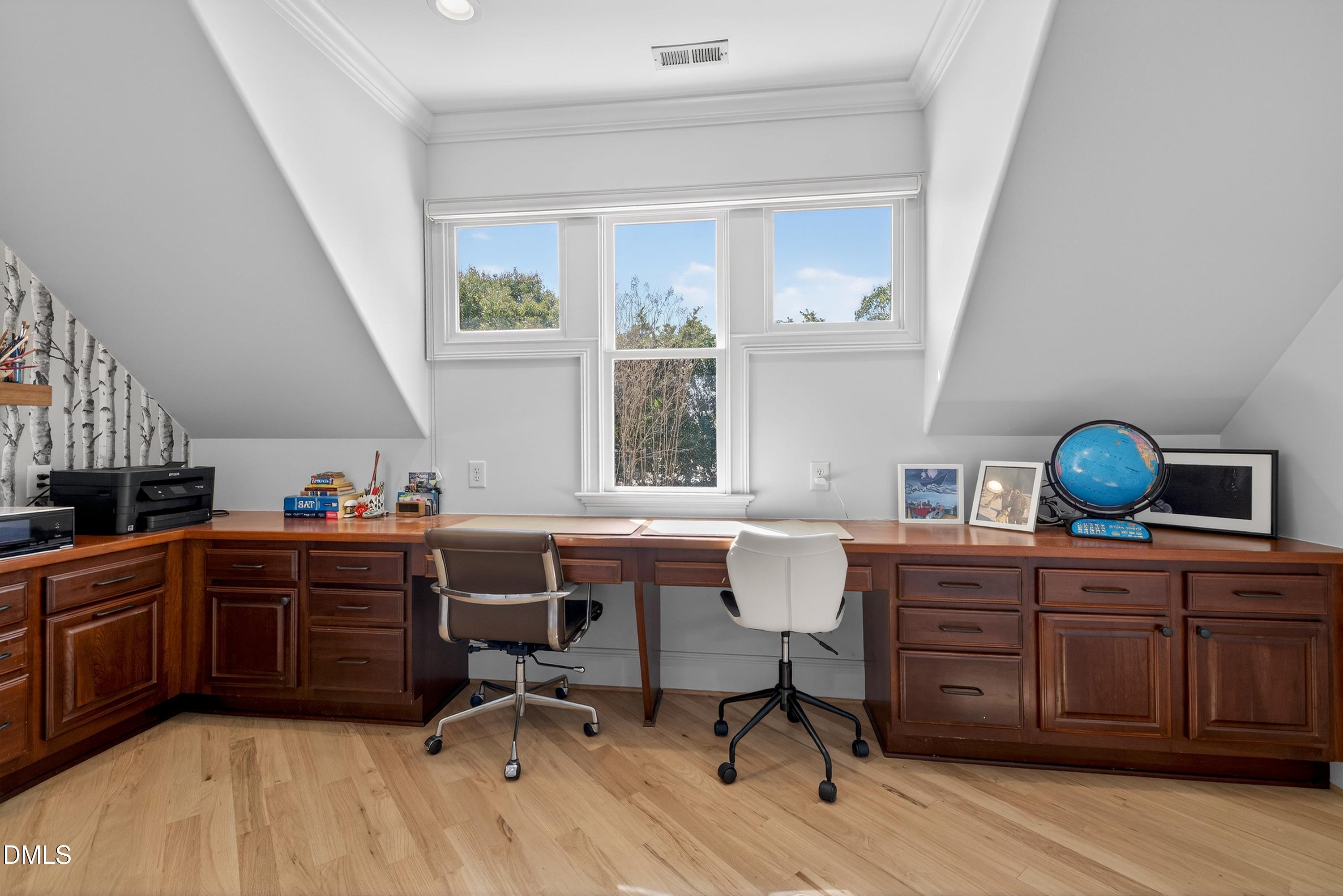 6701 Foxfire Place Raleigh, NC 27615 - Photo 41 of 67 a view of a workspace with furniture and a window