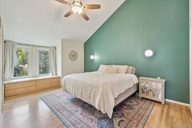 a bedroom with a large bed and a window