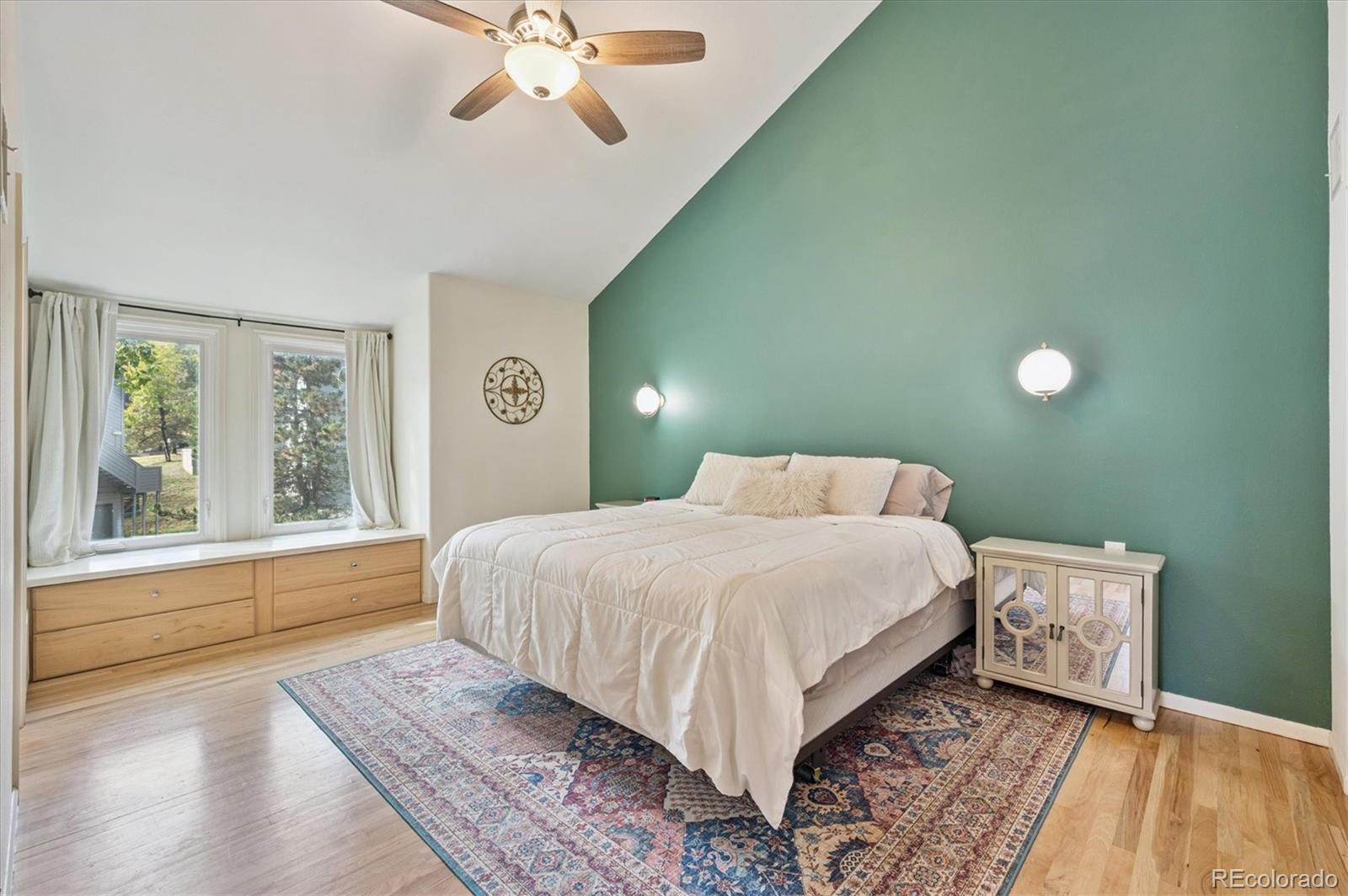 23666 Pondview Place, Unit H Golden, CO 80401 - Photo 13 of 19 a bedroom with a large bed and a window