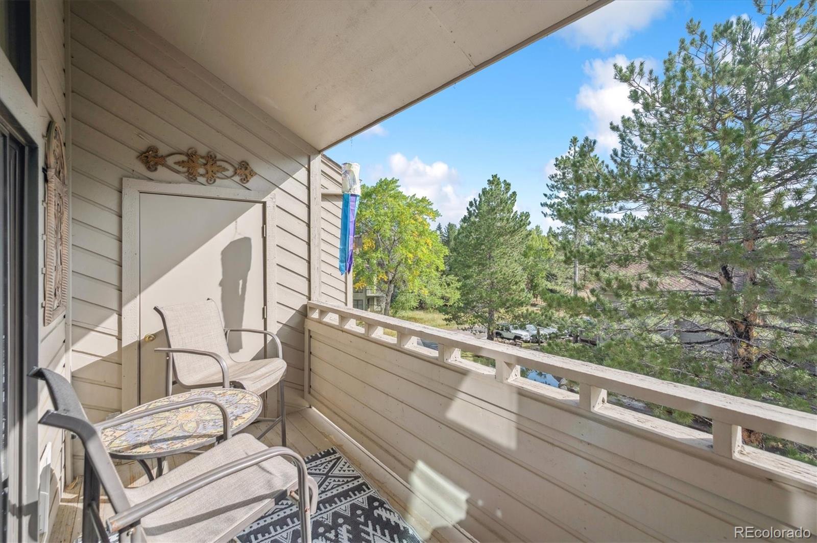 23666 Pondview Place, Unit H Golden, CO 80401 - Photo 18 of 19 a view of a balcony with chairs