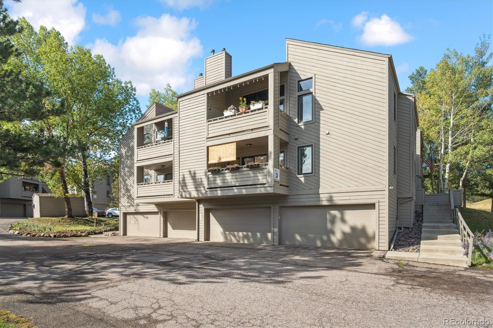 23666 Pondview Place, Unit H Golden, CO 80401 - Photo 2 of 19 a view of a house with a balcony