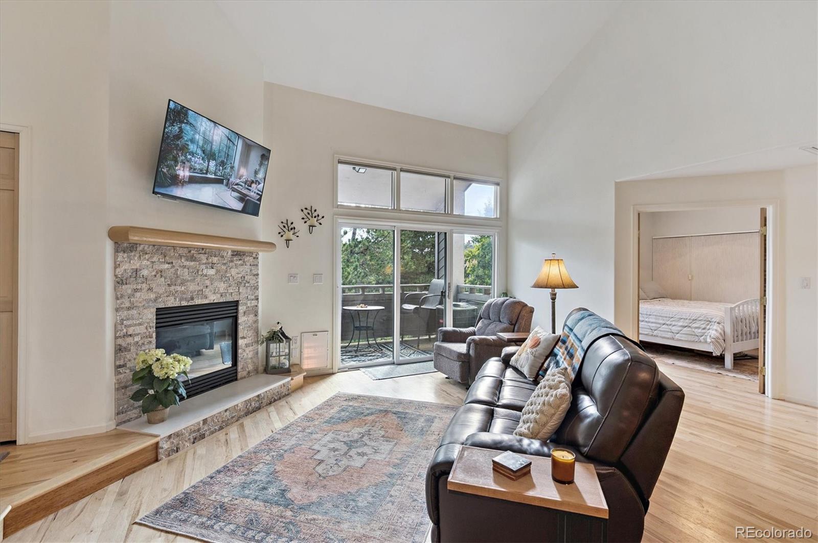 23666 Pondview Place, Unit H Golden, CO 80401 - Photo 10 of 19 a living room with furniture and a fireplace