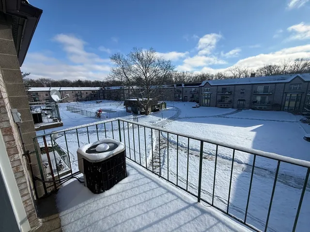 a view of balcony with furniture